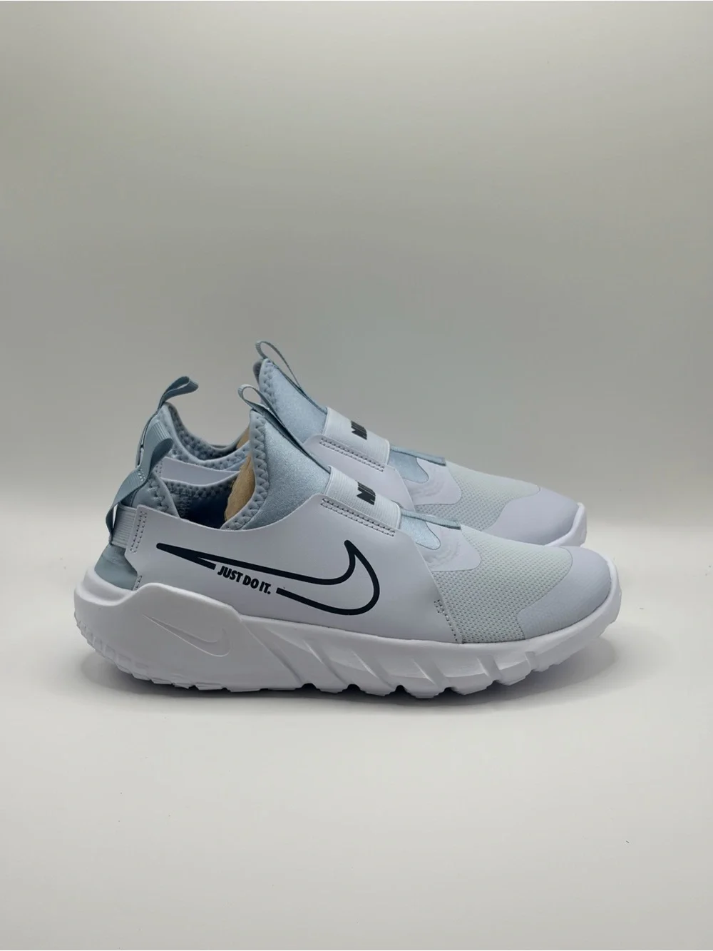 Nike 6Y/7.5W Light Blue and White Slip-On Sneakers with Navy Swoosh